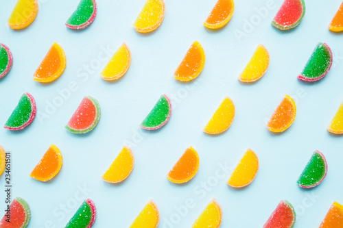 Wallpaper Mural Slices of colorful candied fruit jelly on light pastel blue background. Sweets pattern. Top view. Torontodigital.ca