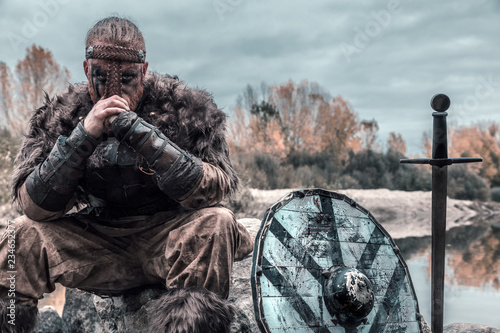 fierce viking warrior wounded in battle