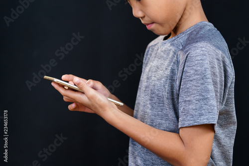 Little kid play a smartpone photo