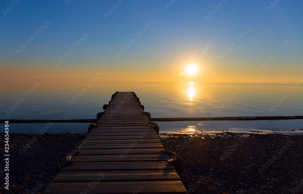 Wooden pier sea sunset.