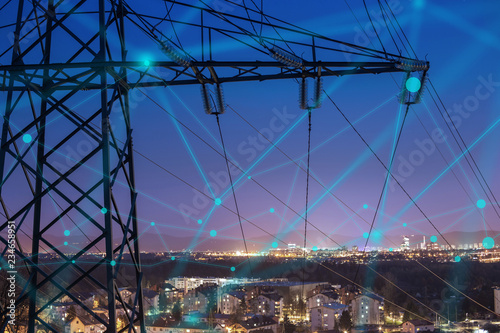 High power electricity poles in urban area connected to smart grid. Energy supply, distribution of energy, transmitting energy, energy transmission, high voltage supply concept photo.