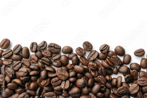 Roasted coffee beans for background.