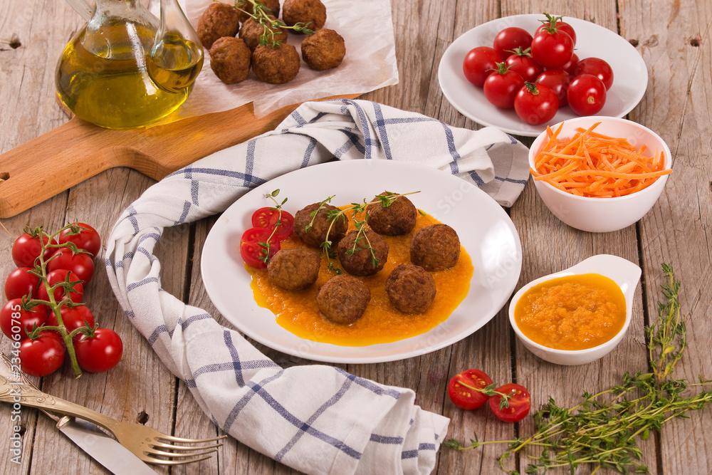 Meatballs with mashed carrots. 