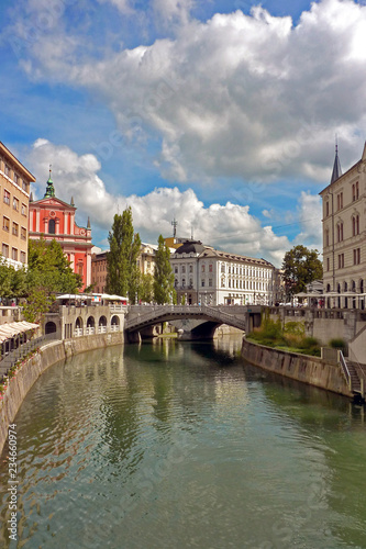 Ljubljana seen through the River Ljubljanica, with the Triple Bridge in the distance