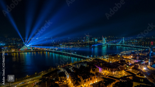 Panoram of Riga city with blue lights in the sky 