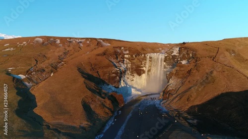 Beautiful icy waterfall on sunny day
