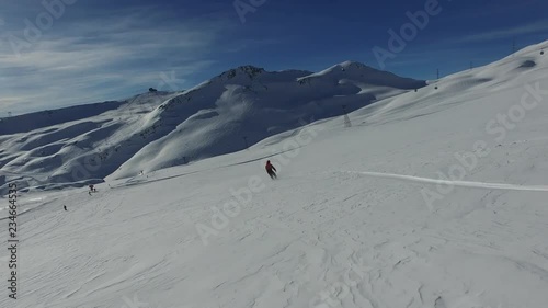lone snowboarder through snow field
