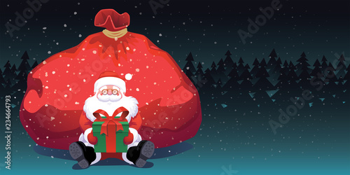 Santa Claus sitting near red bag with green gift box dark forest background