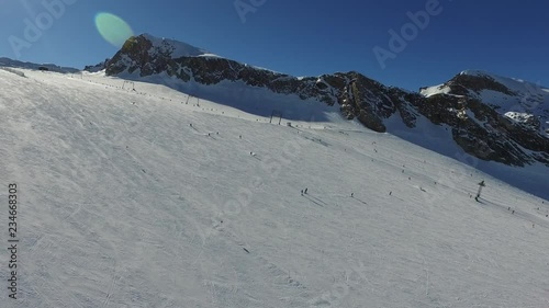 wide empty ski slopes on sunny day