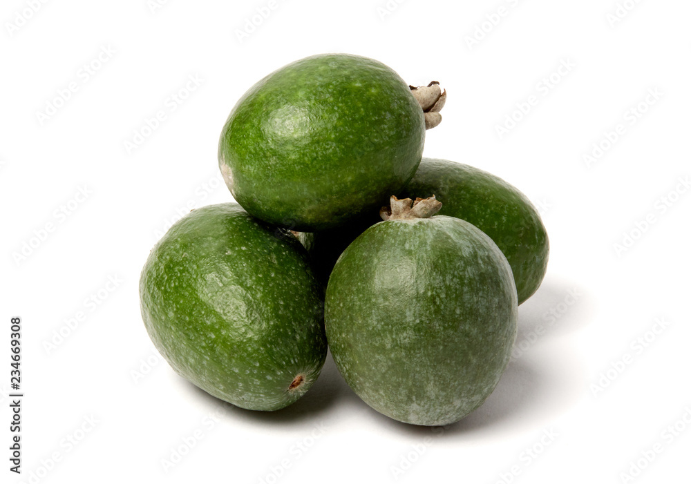 Green feijoa fruits on white background. Green feijoa fruits on white background.