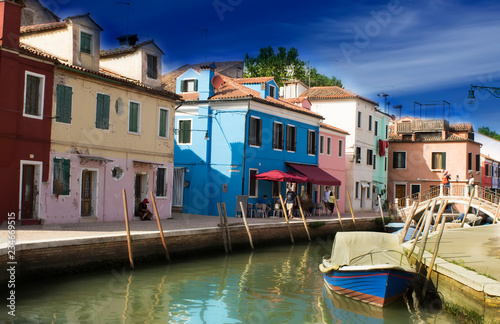 Beautiful Burano in Venice. Colored houses along a dramatic sky channel © sigitas1975