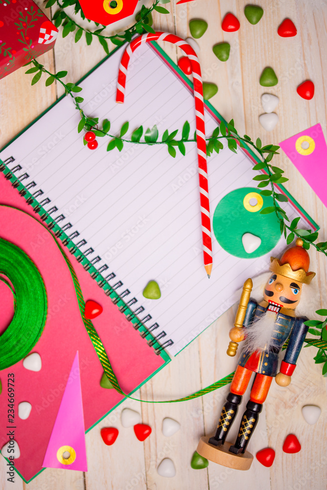 The Nutcracker and Christmas accessories on rustic white woody background