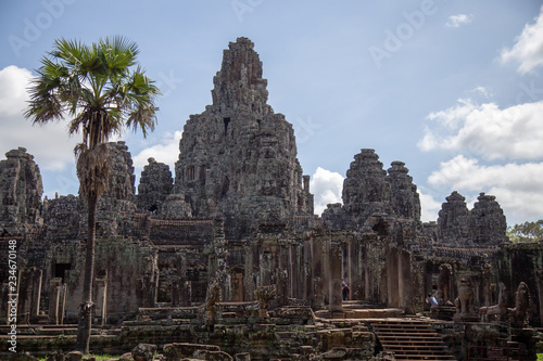 Ancient temple name Bayon Angkor with stone faces Siem Reap, Cambodia. Bayon's most distinctive feature is the multitude of serene and smiling stone faces on the many towers 