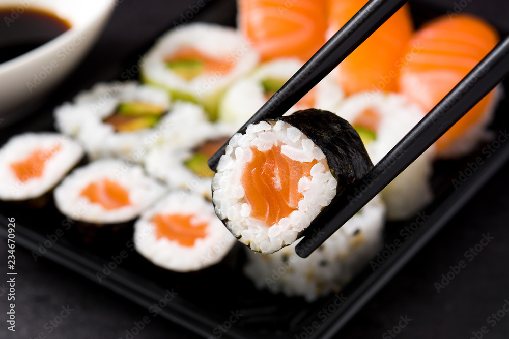 sushi and chopstick on sushi pack background - obrazy, fototapety, plakaty 