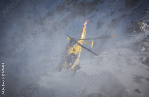 yellow helicopter in the mountains