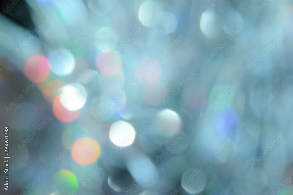 Bokeh photo. Holiday background. Christmas lights. background. Defocused sparkles. New Year backdrop. Festive wallpaper. Blinks. Carnival. Retro style photo. Holographic.
