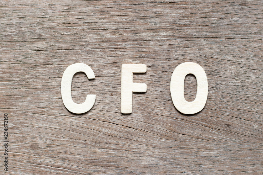 Obraz premium Alphabet letter in word CFO (Abbreviation of Chief Financial Officer) on wood background