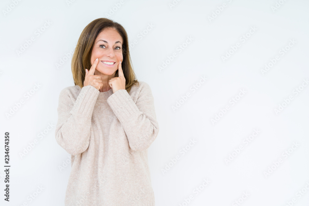 Beautiful middle age woman over isolated background Smiling with open mouth, fingers pointing and forcing cheerful smile Beautiful middle age woman over isolated background Smiling with open mouth, fingers pointing and forcing cheerful smile