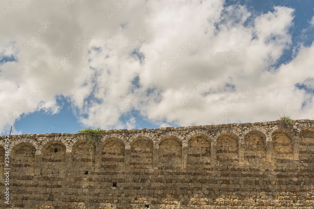 Massa Marittima , Italy - landscape walls of the Sienese fortress with cloud Massa Marittima , Italy - landscape walls of the Sienese fortress with cloud