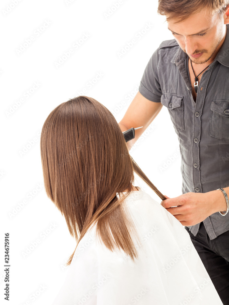 Professional hairdresser with long hair model, isolated on white Professional hairdresser with long hair model, isolated on white