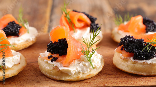 bread with cheese, salmon and caviar photo
