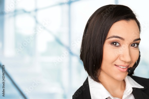 Young woman  with headphones, call center or support concept
