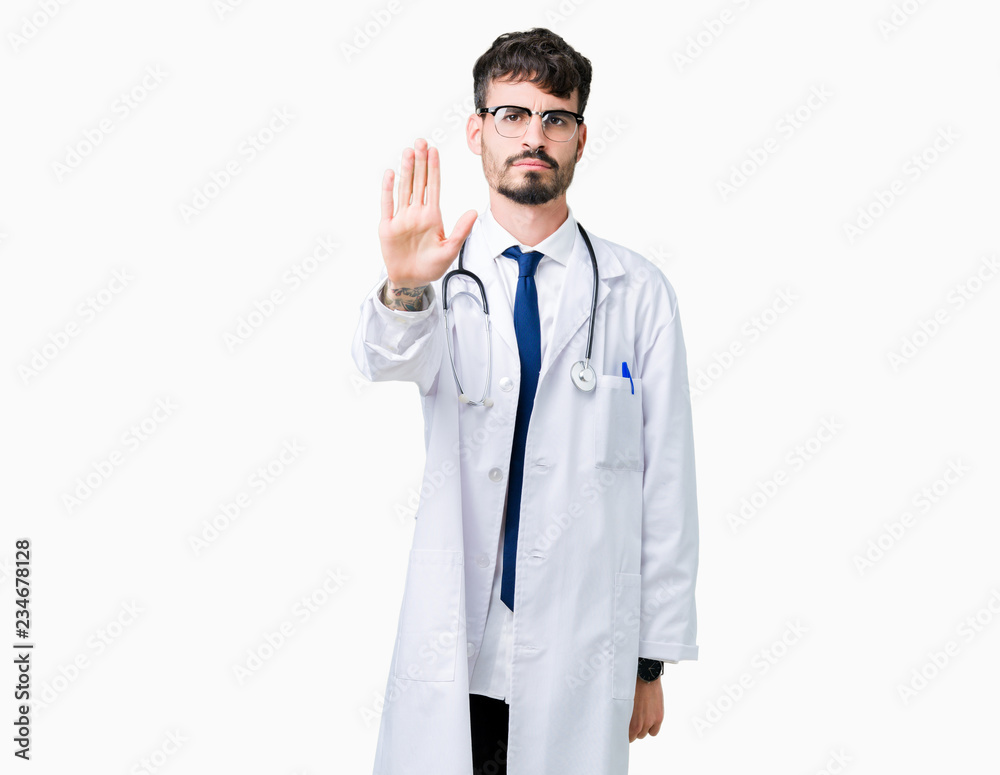 Young doctor man wearing hospital coat over isolated background doing stop sing with palm of the hand. Warning expression with negative and serious gesture on the face. Young doctor man wearing hospital coat over isolated background doing stop sing with palm of the hand. Warning expression with negative and serious gesture on the face.