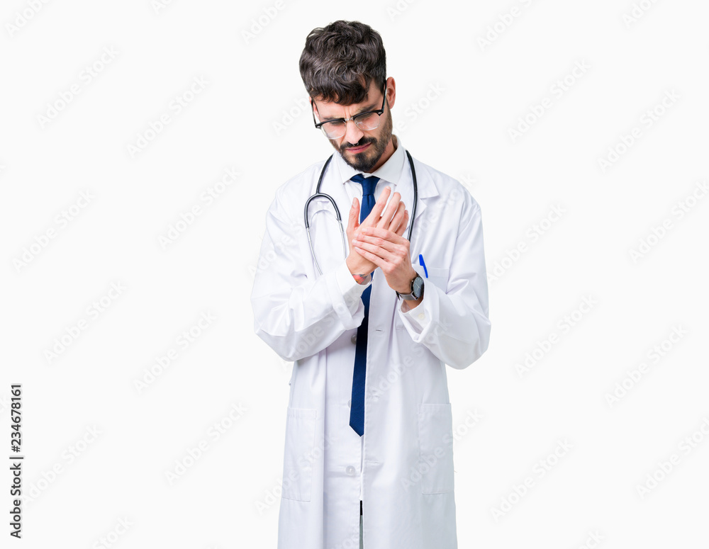 Young doctor man wearing hospital coat over isolated background Suffering pain on hands and fingers, arthritis inflammation Young doctor man wearing hospital coat over isolated background Suffering pain on hands and fingers, arthritis inflammation