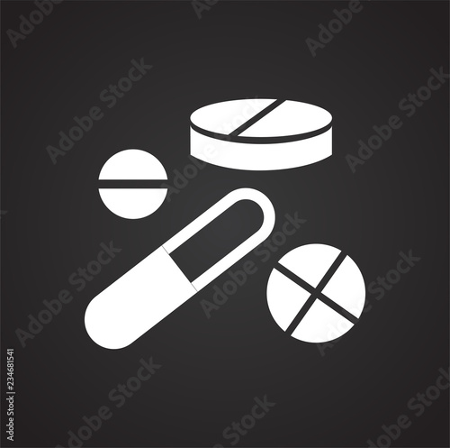 Tablets and pills on black background icon