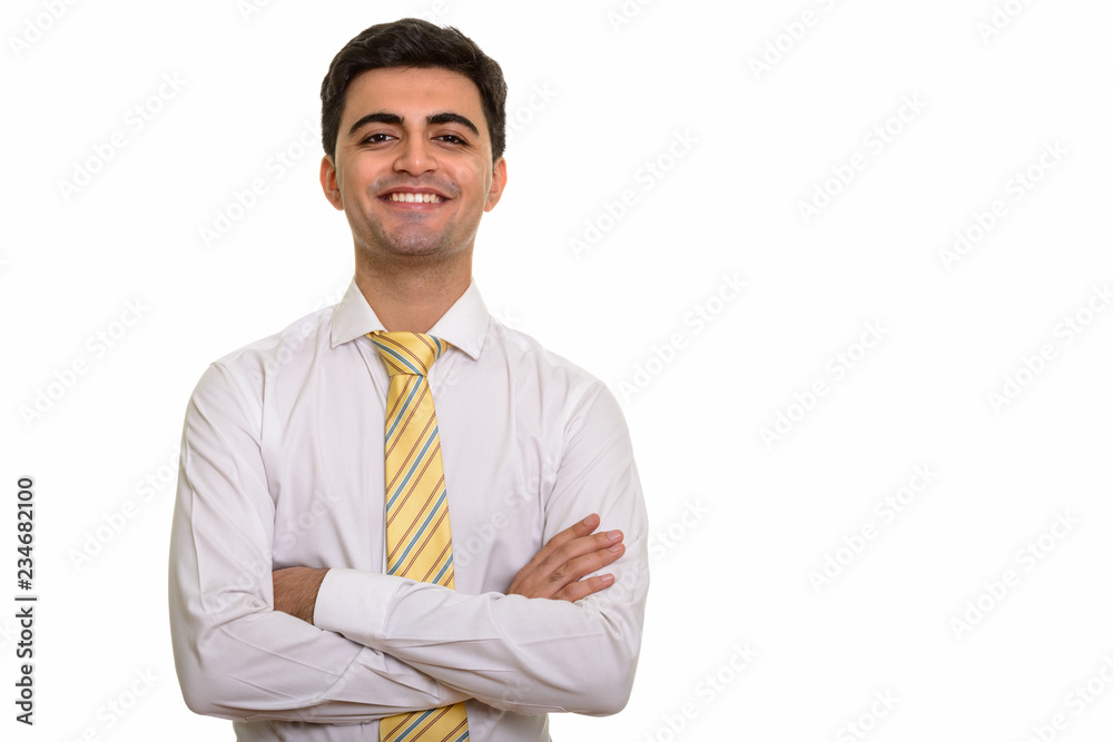Young happy Persian businessman with arms crossed Young happy Persian businessman with arms crossed