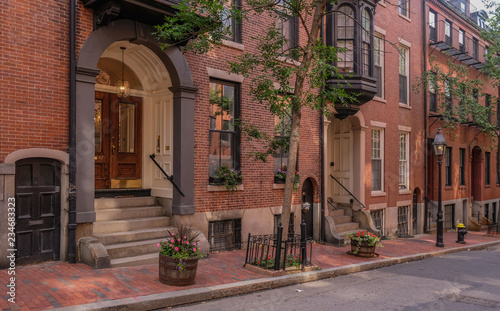 Acorn Street in Beacon Hill district, Boston, Massachusetts, USA - July 28, 2018: Entries of mansions in the Beacon Hill district in the city of Boston photo