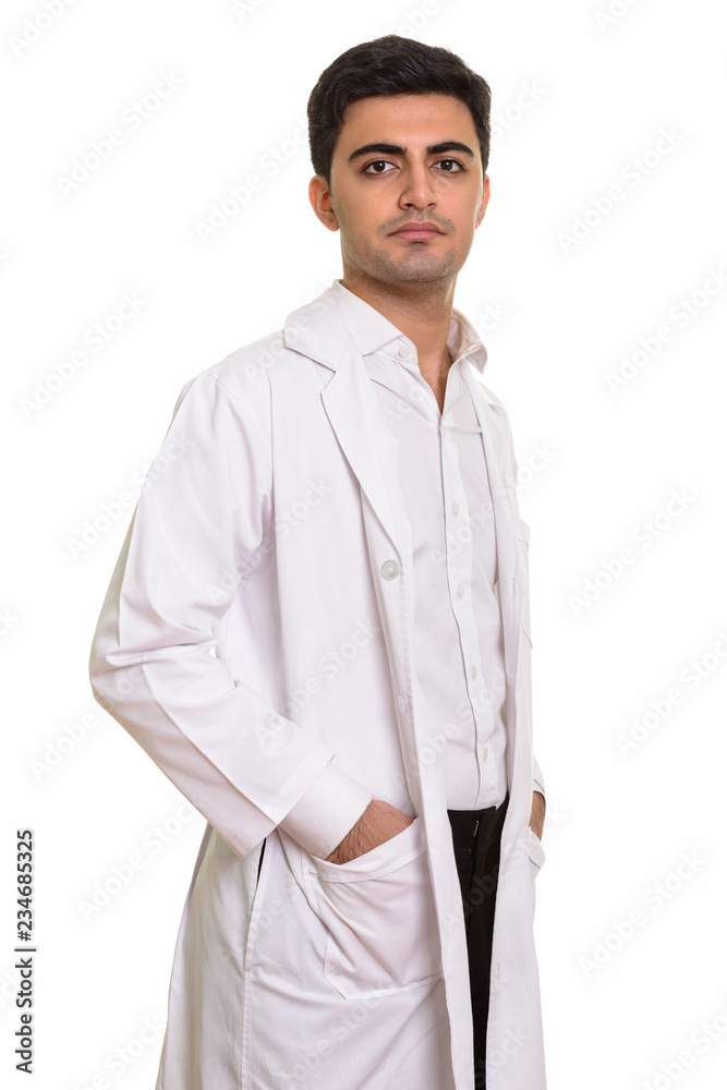Young handsome Persian man doctor looking at camera Young handsome Persian man doctor looking at camera