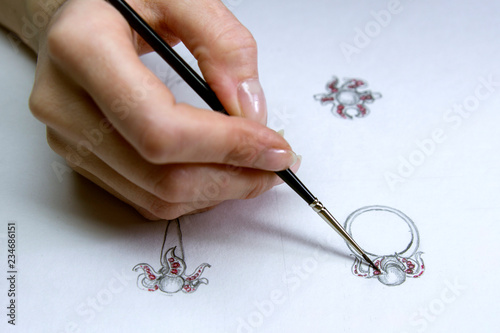 Drawing Jewelry Design. Artist designer  drawing sketch jewelry on paper . Hand made.