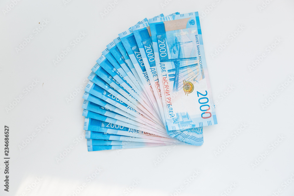 Background Of Paper Russian Money. New Russian Banknotes Of 2000 Two Thousands Rubles. Background Of Paper Russian Money. New Russian Banknotes Of 2000 Two Thousands Rubles.