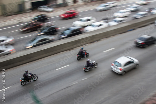Pan shoot of motorcycles at high speed on a avenue. © Alessandro Vecchi