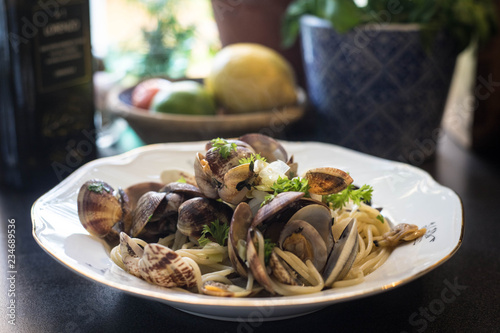 A plate with fresh delicious spaghetti with sea food. Vongole 
