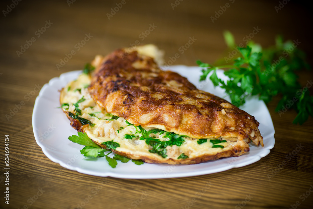 fried omelet with cauliflower and greens in a plate fried omelet with cauliflower and greens in a plate