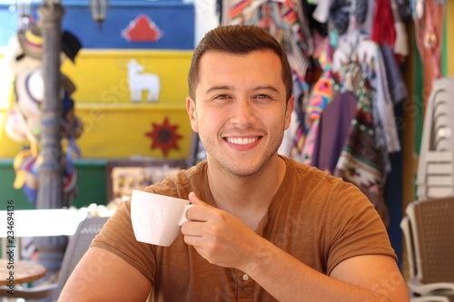 Attractive man enjoying a cup of coffee