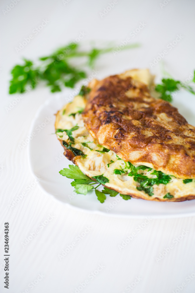 fried omelet with cauliflower and greens in a plate