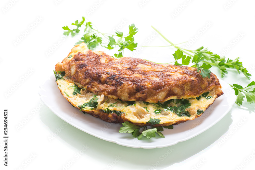 fried omelet with cauliflower and greens in a plate