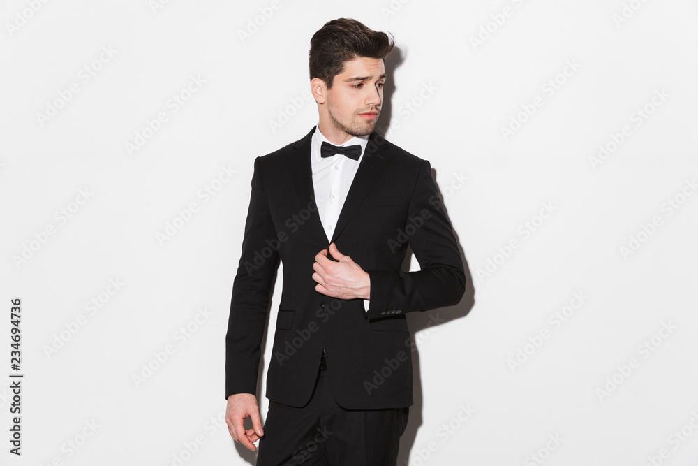 Portrait of a handsome young man wearing black suit Portrait of a handsome young man wearing black suit