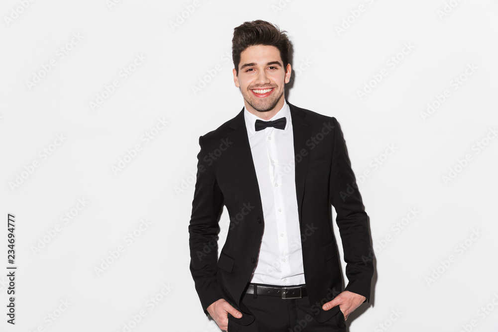 Portrait of a smiling young man wearing black suit Portrait of a smiling young man wearing black suit