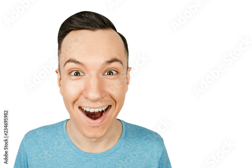 Portrait of young smiling happy guy isolated on a white background.