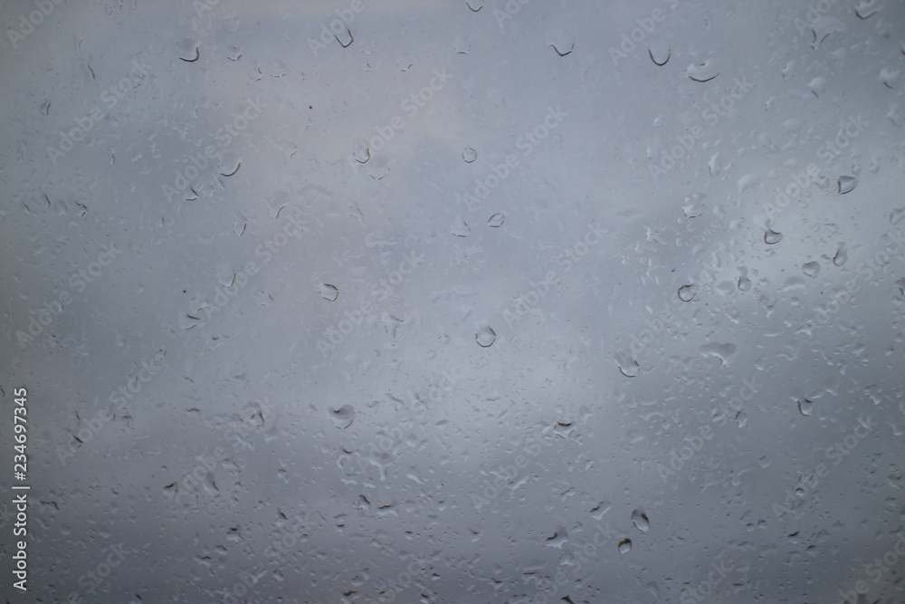 gray autumn sky drops on a window pane gray autumn sky drops on a window pane