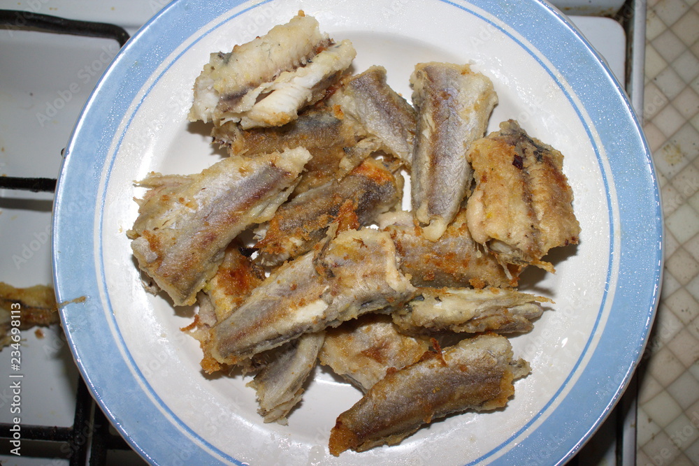 fried fish on a plate fried fish on a plate