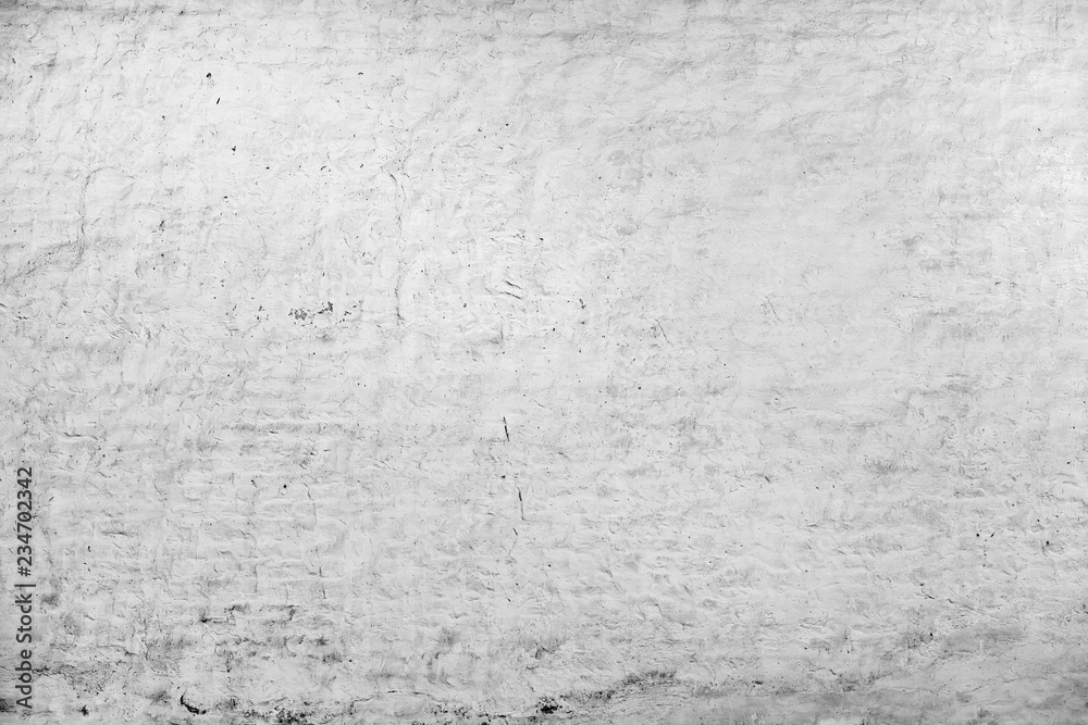 wall with old white plaster as a creative background