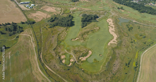 Aerial view Golf course with green grass and ponds. Golf field in the countryside.