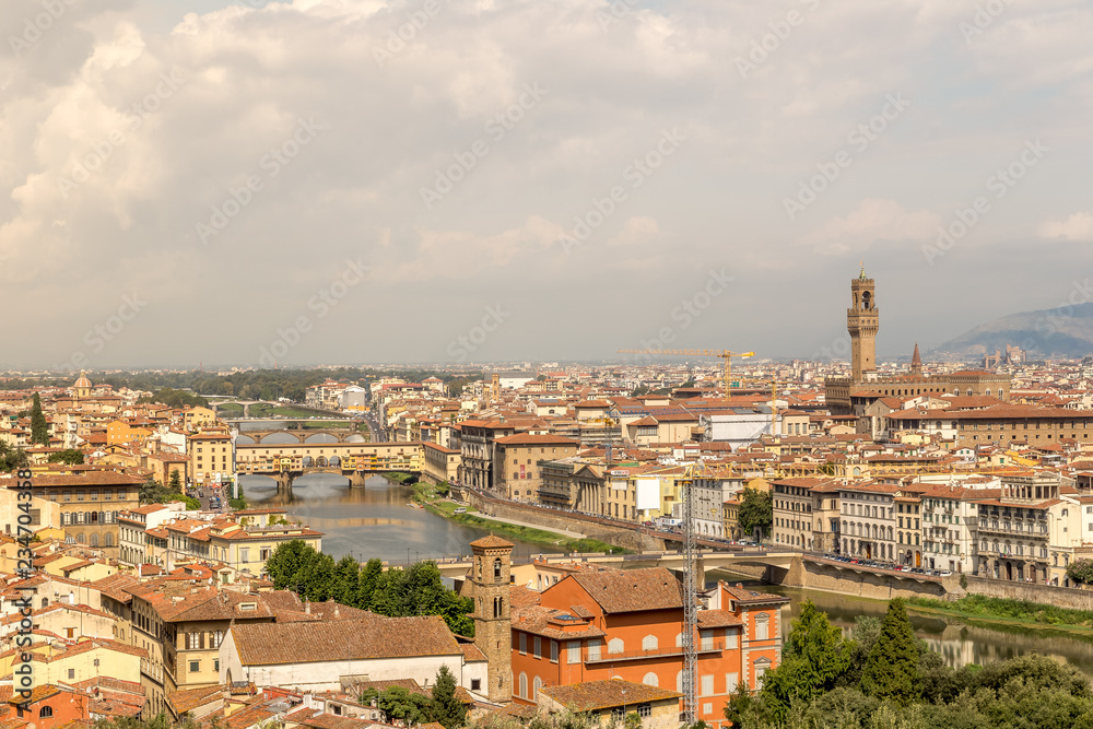 Cityscape of Florence, Italy. Beautiful view of Firenze with famous Ponte Vecchio bridge over the river Arno