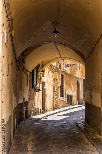 Beautiful narrow street with arch, Florence