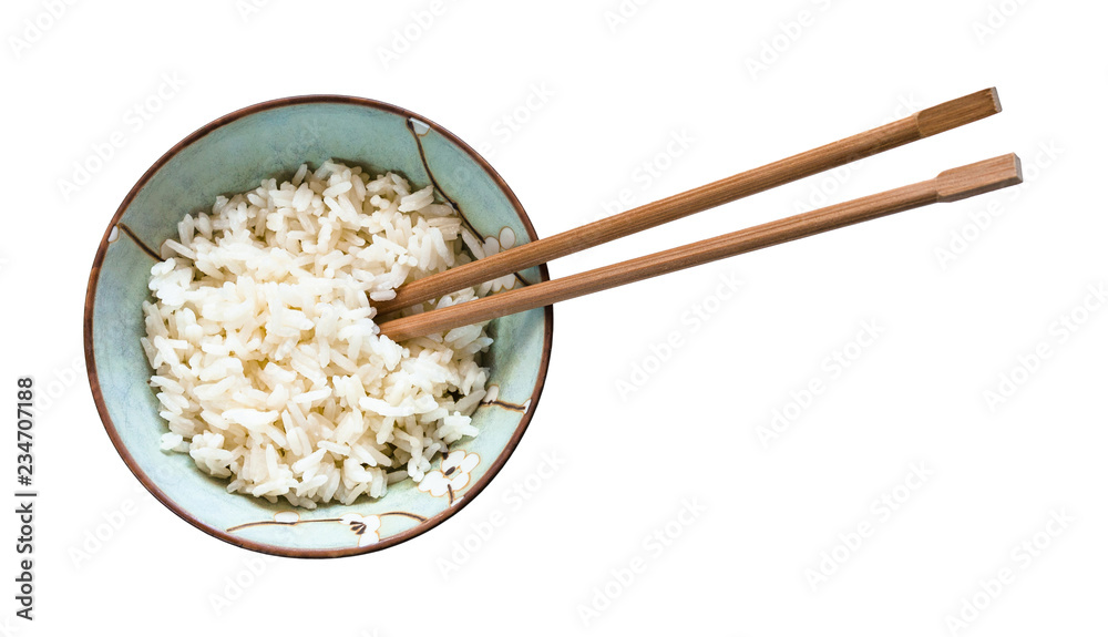 chopsticks in bowl with boiled rice isolated chopsticks in bowl with boiled rice isolated